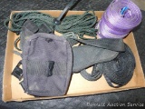 Rope, case holding some pellet gun ammo, straps. Purple polyester straps are sling type A2 and are