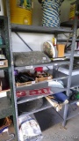 Sturdy metal shelving unit, perfect for organizing your garage or basement. Some rust spots noted on