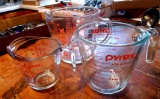 Set of three Pyrex & Anchor Hocking glass measures including one cup, two cup and four cup. All in