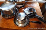 Five copper clad Revere pans including 3/4 quart saucepan, 1-1/2 quart saucepan, 3 quart stockpot,