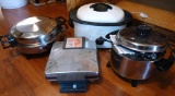 Smaller Nesco roaster, Regal Kitchen Nutrition electric skillet & 5 quart oil core Dutch oven,