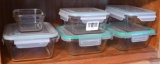 Six Glaslock containers, five with lids. Largest measures 6