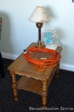 Side table to hold the lamp and fan, and an extension cord to plug them in. Table is about 28