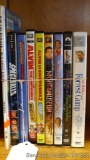 Eight DVDs and a book including Forrest Gump, Alvin and the Chipmunks, Spaceballs, Dennis the