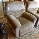 Comfortable rocking recliner matches Lot 795. Nice neutral colors. Some stains or dirt, hopefully