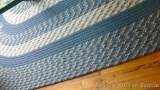 Braided rug is in good condition and measures approx. 4' x 8'.