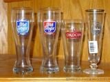 Two Old Style, Okocim and another beer glass. Each Old Style glass is 9