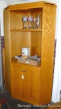 Corner cabinet is made of oak and in good condition. Measures 71
