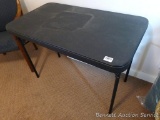 Handy plastic folding table measures 24