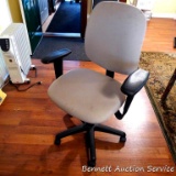 Quality rolling office chair has adjustments for height, arms and tilting back.