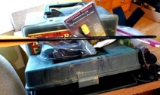 Crossbow items including cocking rope, one arrow, red dot scope. Also included are some archery
