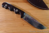 R.E. Richey custom made stainless steel sheath knife with hand stitched leather sheath. Knife is