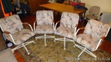 Four upholstered rolling kitchen chairs are sturdy and in overall good condition.