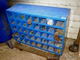 Metal storage cabinet has 40 compartments and is 12