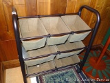 Metal framed frame with cloth organizer baskets. Unit is in overall good condition. Measures 29