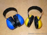 Peltor ear protection muffs. Blue pair is marked Peltor Bull's Eye Ultimate 10, yellow pair is