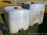 Two plastic water storage tanks. Largest is 300 gallon.