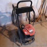 Clean Power power washer on wheels has a 6.5 HP Briggs & Stratton motor. Comes with wand and hose.