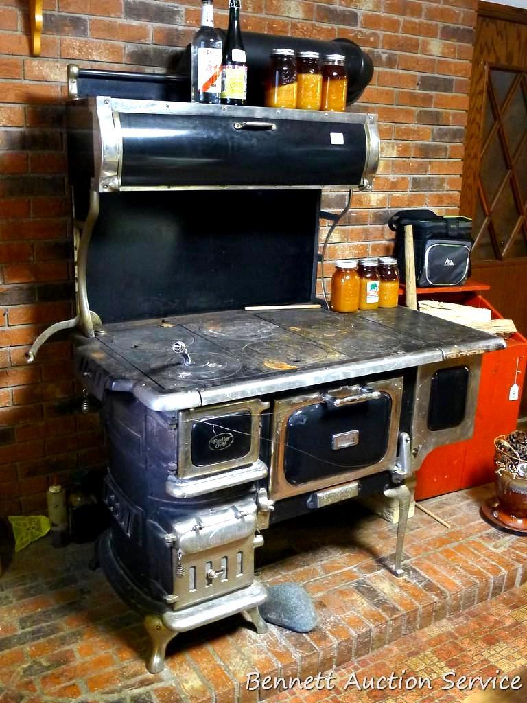 Antique Elmira Stove Works wood cook stove with six burners, plus warming  oven, hot water reservoir.