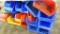 Large assortment of plastic storage bins, some stackable, some nesting. Largest is 16-1/2