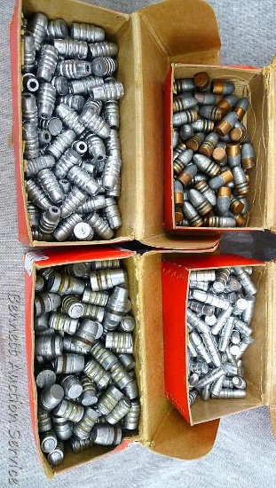Assorted cast lead bullets including capped base, flat round nose, hollow point, others.