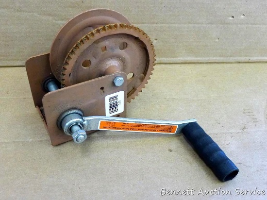 DL winch has a 1,200 lb capacity. Marked "DLB1200A". Main part is about 8" x 4" x 7", handle is