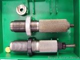 Two RCBS reloading dies for 7mm Rem. Mag. Plus a No. 4 shell holder.