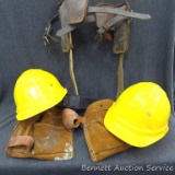 Leather tool belt; Linesman pole climbers and 2 Omega II hard hats.
