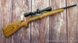 Thompson Center 22 Classic Benchmark semi-automatic rifle in .22LR has a 3-9x40 scope in quick