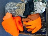 Four blaze orange stocking caps; 3 camo helmets; one reversible to orange; camo gloves size XL;