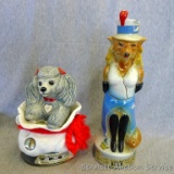 Two Jim Beam bourbon whiskey decanters, taller is unopened and still has some in it.. Will drain if