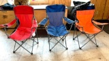 3 folding arm chairs with beverage holders; one orange/black, one blue/gray; one red/gray; camping;