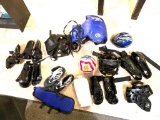 Gym bag full of Taekwondo equipment, includes chest protectors, head gear, foot and hand pads, also