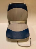 Folding Fishing Boat Seat; noted crack in plastic seat base; snap closure; hinges and upholstery in