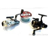 Fishing Gear; 2 Fishing Reels and Fishing Line; One Reel is Quantum Optix 20 Spinning Reel, 4