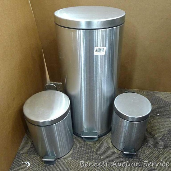 Set of 3 metal foot operated garbage cans with plastic removable liners. Largest is 24-1/2" x