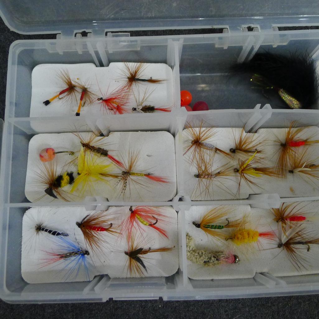 Fly fishing flies in 4 x 9 plastic divided box.