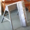 Pair of metal folding saw horses, each 31