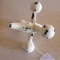 Cast iron replica of a toy jack could be used as a paper weight. Center is 6