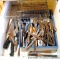 Two utensil organizers with assortment of silverware and sharp knives.