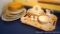 Large platters including a Christmas platter, pie plate, serving bowls; creamer, butter dish, napkin