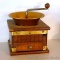 Retro coffee grinder has copper toned accents and measures 6-1/2