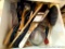 Kitchen utensils including tongs, spatulas, strainer, wooden spoons, whisk, lots more.