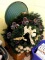 Several wreathes, plus a nearly 2' wide Christmas tree stand. Wreaths with lights work as they