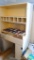 Wooden desk with large drawer under table, 2 side storage areas below, sectioned storage shelf