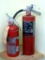 Ansul Sentry and Super Pro fire extinguishers. Both read 'Charged'. Taller is 17