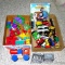 Train sections that connect with magnets; wooden train parts; several toddler and baby toys and