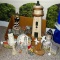 Collection of wooden and plaster lighthouse figurines. Largest is 20