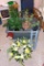 Sterilite 30 gallon tote with lid filled with artificial greenery; pretty bird wind chime;