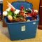 Rubbermaid 36 gallon tote filled with silk flowers, grapevine wreath, tins and more; tote measures